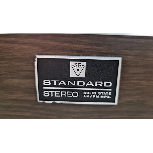 457 - Vintage Standard SR Stereo Console, solid-state AM/FM MPX with wood veneer casing, mid-century moder... 