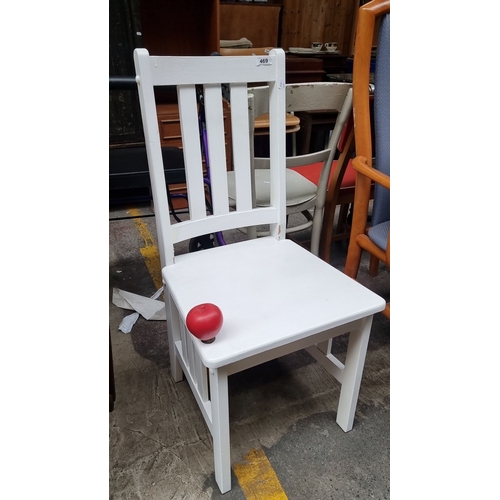 469 - White wooden chair with slatted backrest and seat, simple and sturdy design.