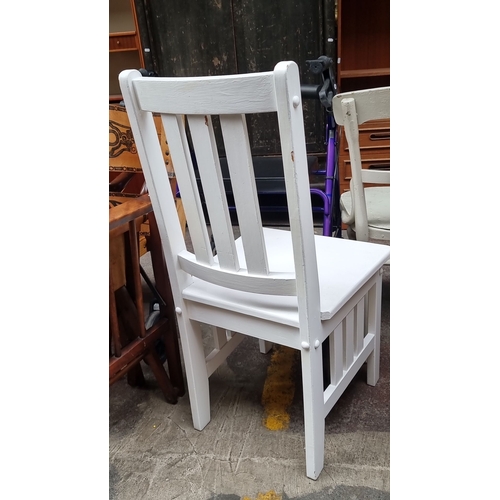 469 - White wooden chair with slatted backrest and seat, simple and sturdy design.