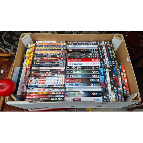 477 - Boxed mixed lot of 61 DVDs including NCIS Seasons, Resident Evil Collection, The Guard, The Terminat... 