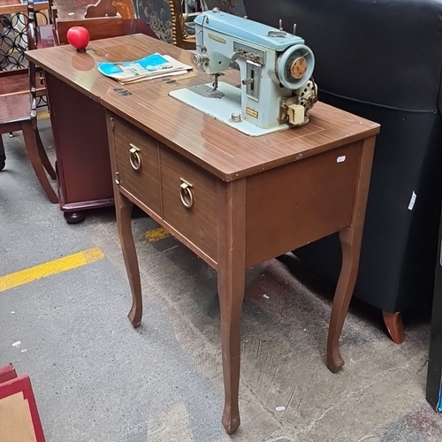 481 - Vintage Brother sewing machine with integrated wooden cabinet and two storage drawers. The machine f... 