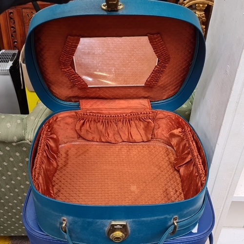 495 - Pair of vintage blue travel cases with handle. Each case features a secure latch and lined interior ... 