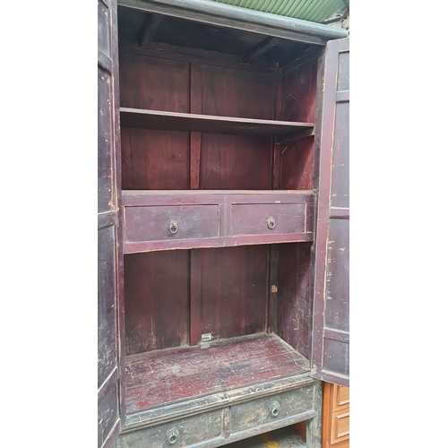 498 - Star Lot : Chinese antique wooden tall cabinet with metal hardware, dual front doors, two lower draw... 