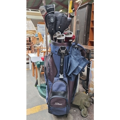 471 - Complete golf set featuring Titleist golf bag, Burner Superfast club, assorted irons, and accessorie... 