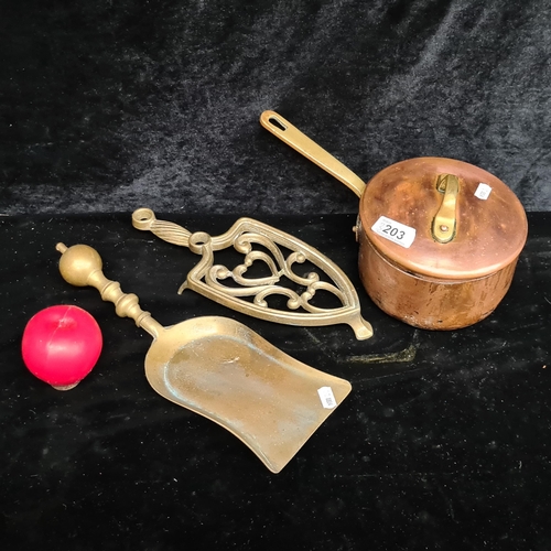 203 - Three vintage items including a brass fire side, a trivet and a copper lidded saucepan.