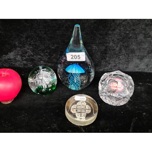 205 - Four very pretty glass paperweights. That Jelly fish one is fab.