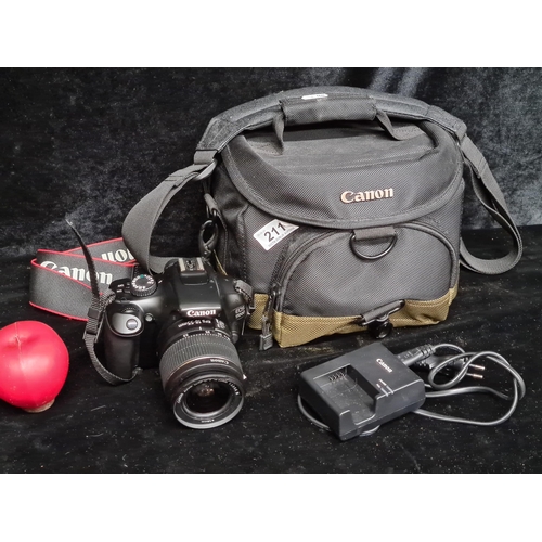 211 - Star Lot : A Canon EOS 1100D camera with 18-55mm wide angle, zoom lens, shoulder strap, lens cap and... 