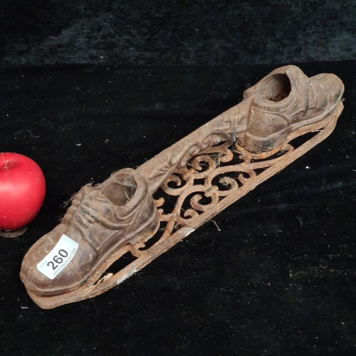 260 - An early 20th century heavy cast iron boot scrape4 with shoe design.