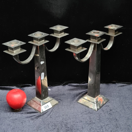 305 - A fabulous pair of three branch chrome candle sticks. With felt base.