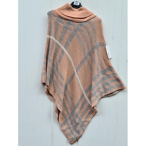 344 - A new with tag 'Italy Moda' poncho. Onesize.
Features soft pink and grey blue tones.