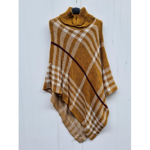 349 - A new with tag 'Italy Moda' poncho. Onesize.
Features a colour palette ochre yellows, whites and dee... 