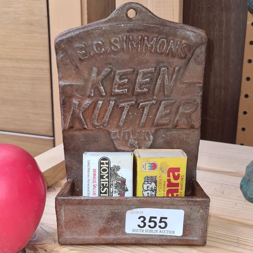 355 - A wall mounted cast metal keys holder advertising Keen Kutter.