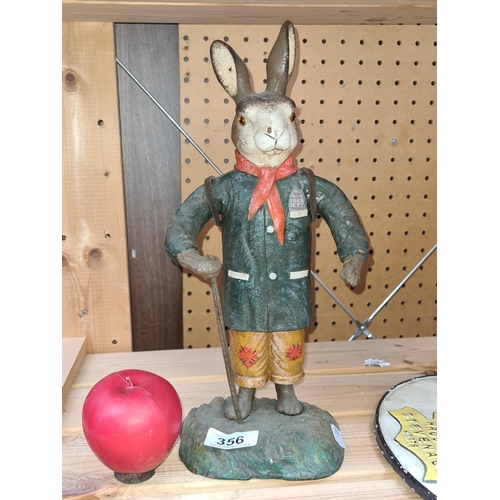 356 - A charming characterful cast metal figure of an exploring hare.