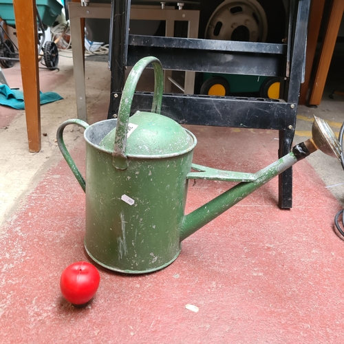 369 - A vintage metal watering can.