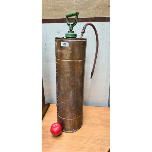 375 - A large antique brass 'Mysto' knap sack sprayer. Lot of brass in this.