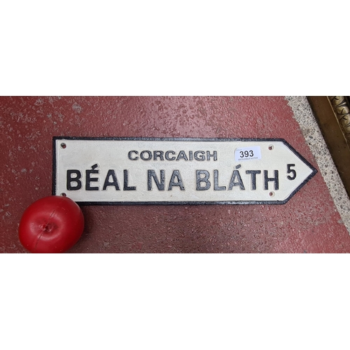 393 - A cast iron wall sign reading 'Corcaigh Béal na Bláth' the spot where Michael Collins was shot.