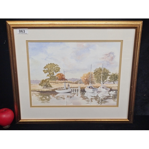 63 - A charming watercolour on paper painting. Features a serene landscape scene with boats and figures. ... 