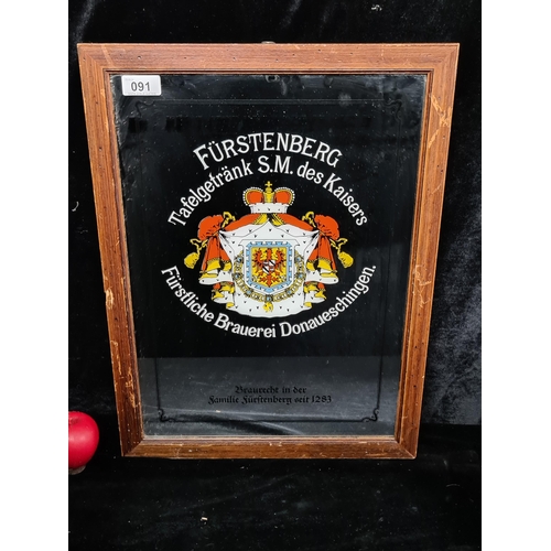 91 - A 1980's advertising pub / bar mirror for Furstenberg lager. Housed in a wooden frame.