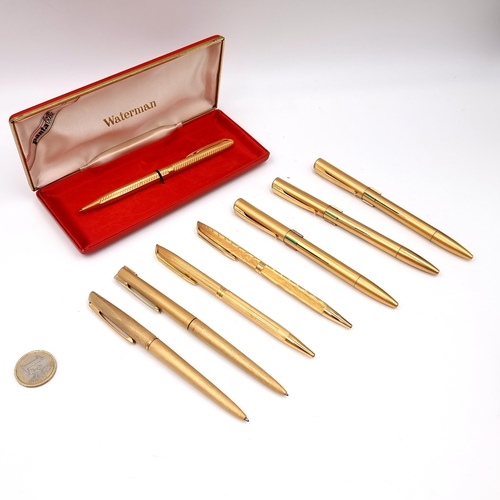 13 - A nice collection of eight gold toned, made in France, Waterman pens including an encased example.