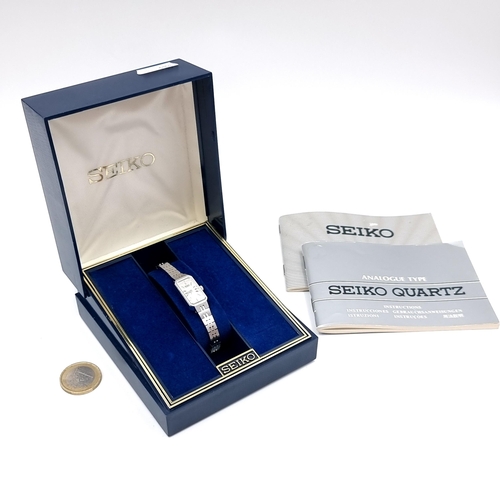 17 - A SEIKO Quartz stainless steel wrist watch. No. 900329. Housed in original SEIKO branded watch box.