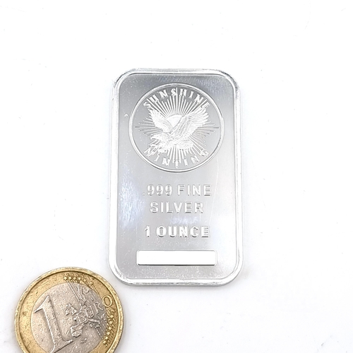 35 - A Sunshine Minting .999 fine silver 1 ounce medallion encapsulated in solid silver bar.