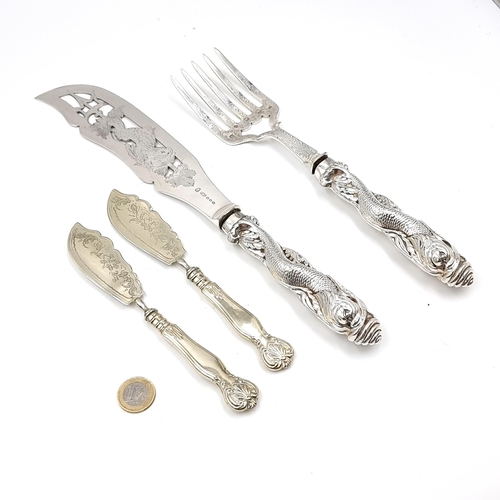 43 - A very elaborate silver plated fish carving set with pierced and edged design into blade as well as ... 