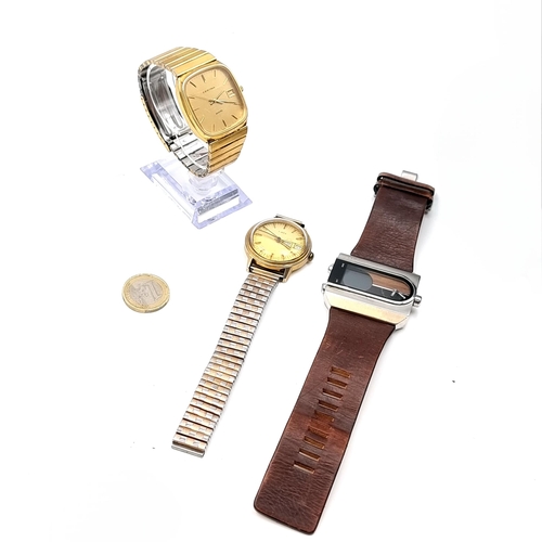 47 - A collection of three watches. The first a Fossil watch with a rectangular face and original leather... 