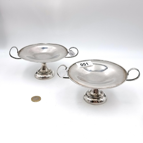 51 - A pair of Anglo Indian sterling silver bon bon /sweet dishes mounted with c handles on a round pedes... 