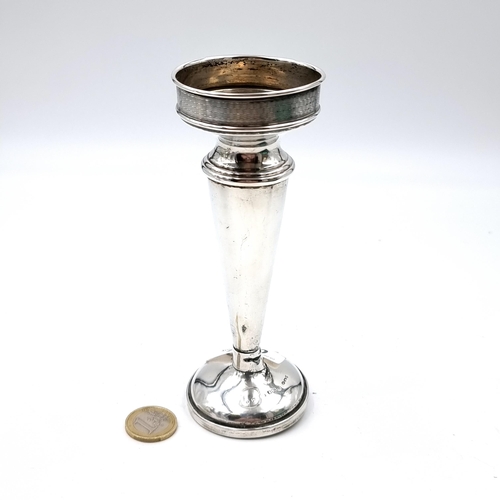 58 - A sterling silver early 20th century trumpet vase with a tapering body sitting on a round pedestal f... 