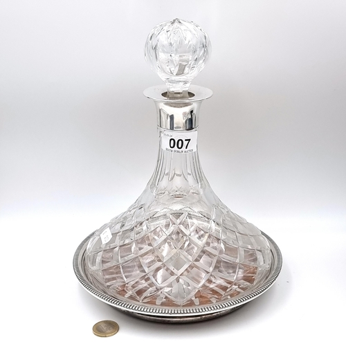 7 - A magnificent Brierley cut crystal decanter with sterling silver neck, together with a huge rare dec... 