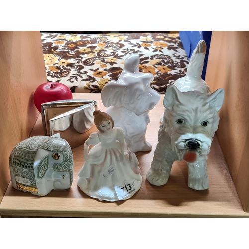 713 - Five vintage pieces including a Royal Doulton figure, a compact desk calendar and two dog figures.