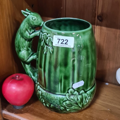 722 - A striking Sylvac water jug in the form of a squirrel claiming upon a chestnut.