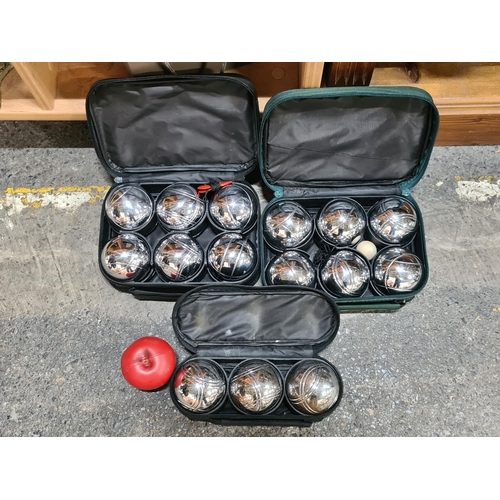 727 - Three cases of the game boules.