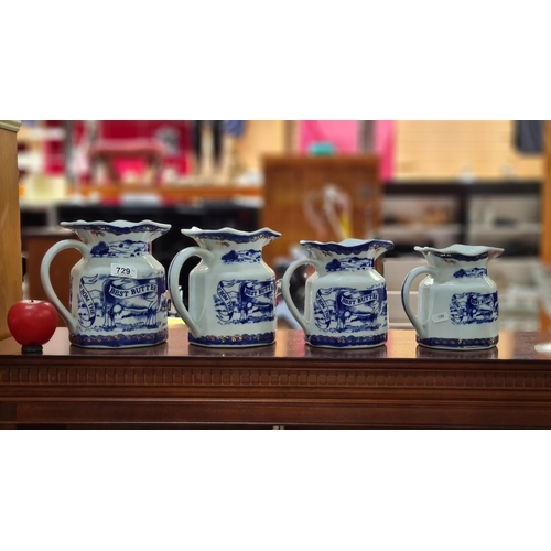 729 - Four graduating Victoria ware Iron stone Pitcher Jugs. Features countryside landscape scenes in blue... 