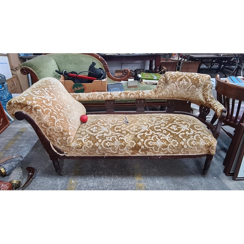 759 - An early 20th century antique chaise lounge with mahogany frame on castors. Upholstered in velvet da... 