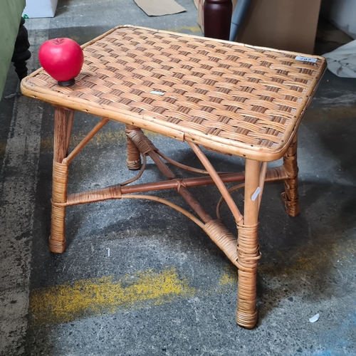 797 - A neatly sized vintage wicker side table.