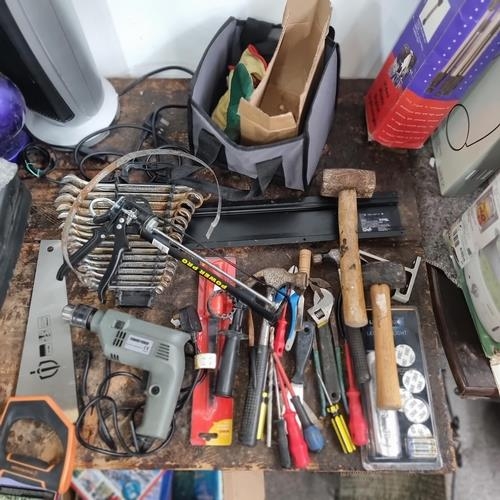 798 - A large mixed lot of tools including hand saw, hammer, spanners and wrenches, electric drill.