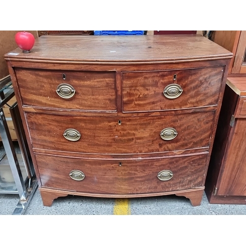 643 - Star Lot : Georgian mahogany bow-front chest of drawers with brass oval handles, featuring two short... 