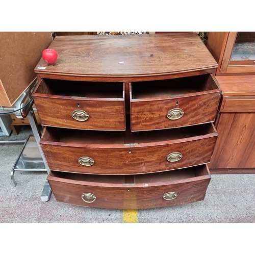 643 - Star Lot : Georgian mahogany bow-front chest of drawers with brass oval handles, featuring two short... 