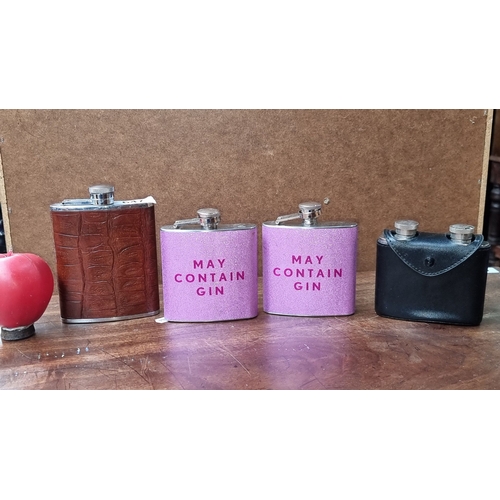 647 - Collection of five hip flasks, including two pink flasks, a crocodile leather-wrapped flask, a black... 