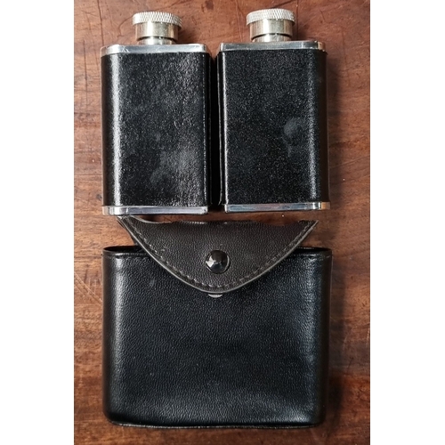 647 - Collection of five hip flasks, including two pink flasks, a crocodile leather-wrapped flask, a black... 