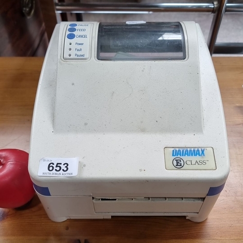 653 - Datamax E-Class label printer features easy operation with pause, feed, and cancel buttons. It has a... 