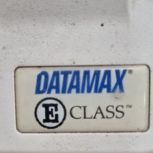 653 - Datamax E-Class label printer features easy operation with pause, feed, and cancel buttons. It has a... 