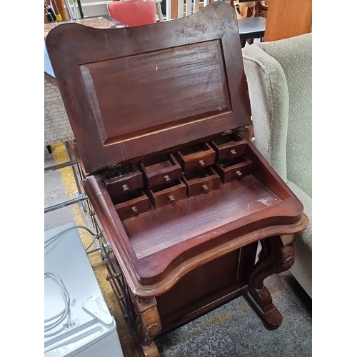 657 - Star Lot : Victorian mahogany writing desk with lift-top revealing multiple small drawers and compar... 