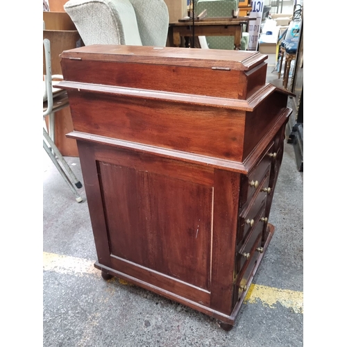 657 - Star Lot : Victorian mahogany writing desk with lift-top revealing multiple small drawers and compar... 