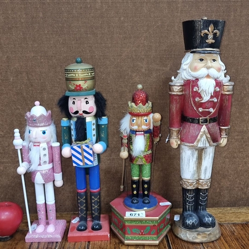 671 - Set of four wooden Nutcracker figurines, each depicting distinct characters in festive attire, rangi... 