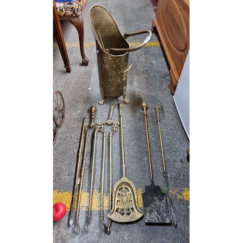 674 - Brass fire tools and coal scuttle set. Includes various tools with ornate detailing, featuring a pie... 