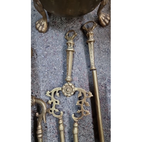 674 - Brass fire tools and coal scuttle set. Includes various tools with ornate detailing, featuring a pie... 