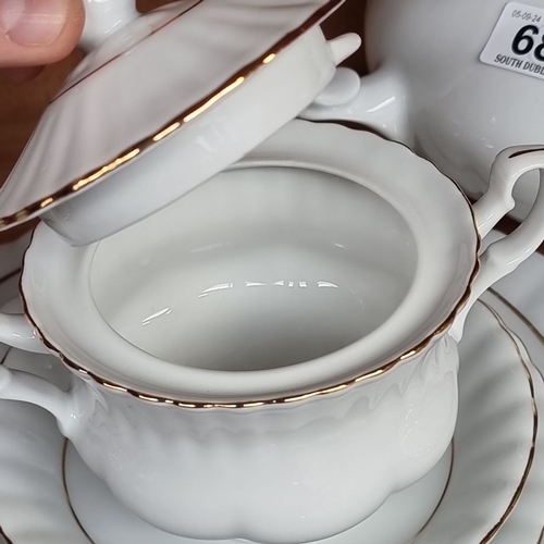 682 - Chodzież porcelain tea set, white with gold trim, includes teapot, creamer, sugar bowl, six teacups ... 