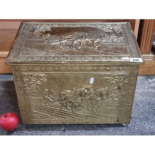 696 - Ornate brass storage box featuring intricate bas-relief scenes of horses and farm life, from the ear... 